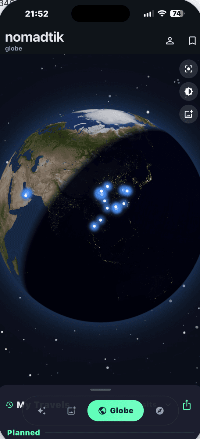 nomadtik interactive 3D globe showing past trips rediscovered from photos and planned destinations glowing across continents